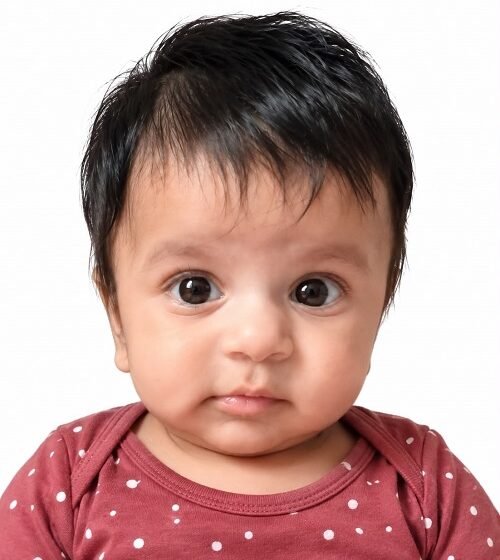 INFANT TO HOLD A FEEDING BOTTLE INDEPENDENTLY