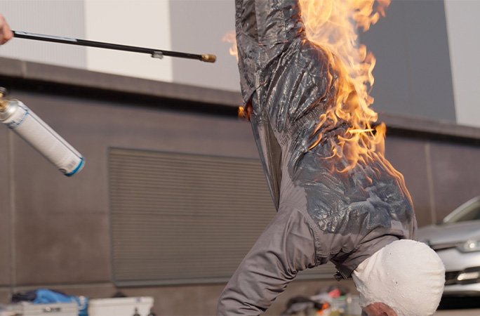 Stuntman set on fire while doing a handstand holds position for record-breaking time