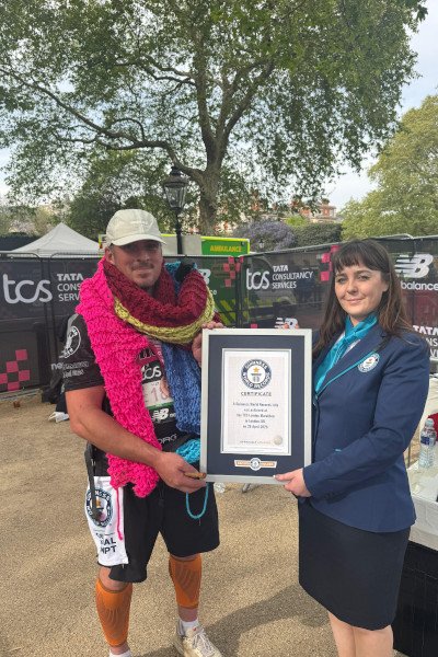 A stitch in (record) time: Marathon runner knits scarf as long as a giraffe during race