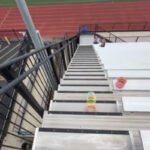 stairs-slinky-the-slinky-descending-towards-field.jpg